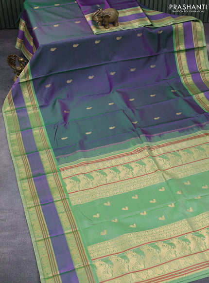 Pure kanchipuram silk saree dual shade of greenish purple and pastel green with paisley zari woven buttas and rettapet zari woven border