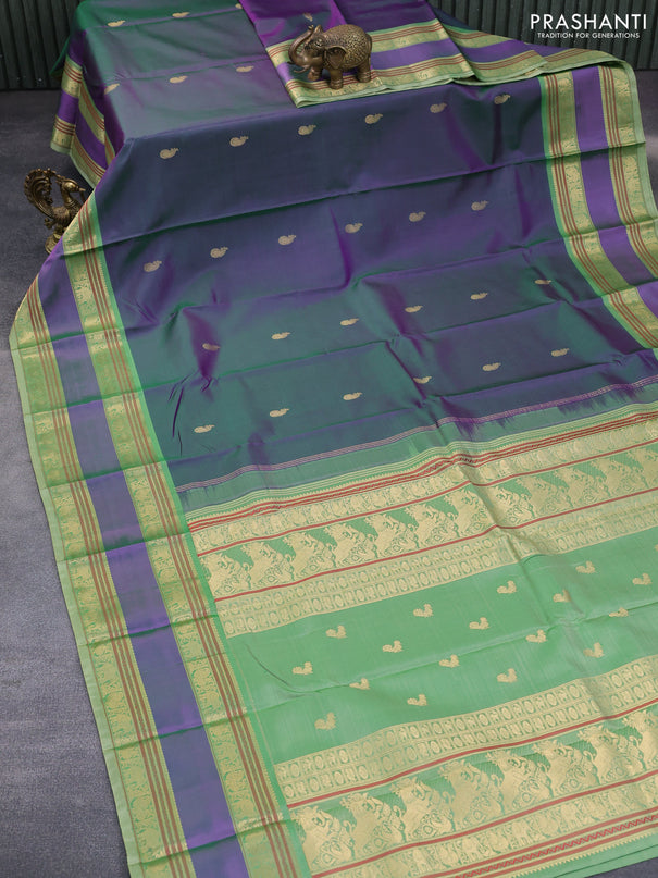 Pure kanchipuram silk saree dual shade of greenish purple and pastel green with paisley zari woven buttas and rettapet zari woven border