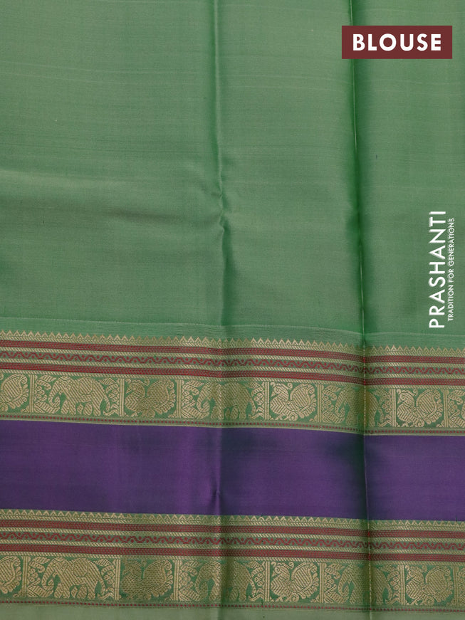 Pure kanchipuram silk saree dual shade of greenish purple and pastel green with paisley zari woven buttas and rettapet zari woven border