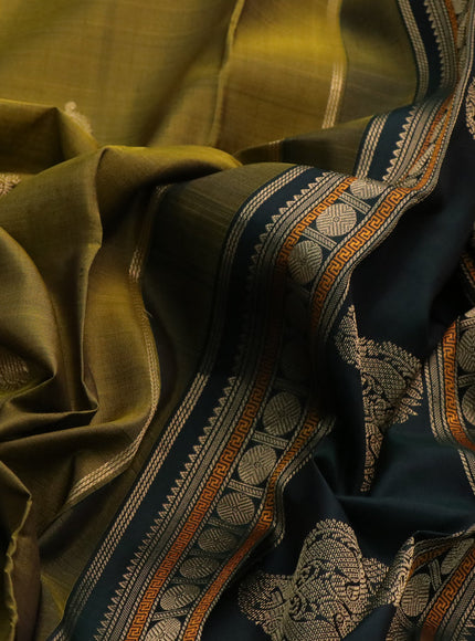 Pure kanchipuram silk saree mehendi green and bottle green with paisley zari woven buttas and rettapet zari woven border