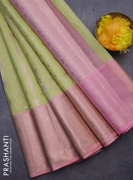 Cotton zari kota saree light green and peach pink with allover zari weaves and long zari woven border