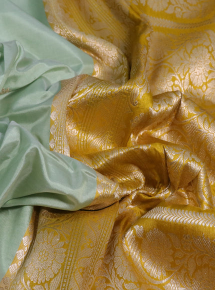 Pure banarasi katan silk saree pastel green and yellow with zari woven floral buttas and zari woven floral border