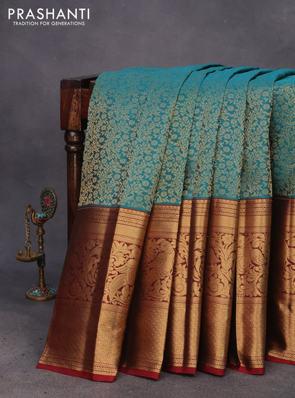 Kanchipuram silk saree teal green and maroon with allover zari woven brocade weaves and long zari woven border