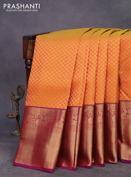 Kanchipuram silk saree mustard yellow and purple with allover zari woven brocade weaves and long zari woven border