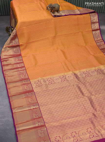 Kanchipuram silk saree mustard yellow and purple with allover zari woven brocade weaves and long zari woven border