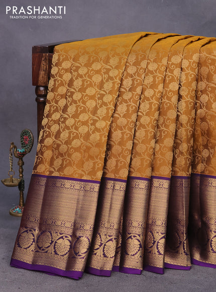 Kanchipuram silk saree dark mustard and deep violet with allover zari woven brocade weaves and long annam zari woven border