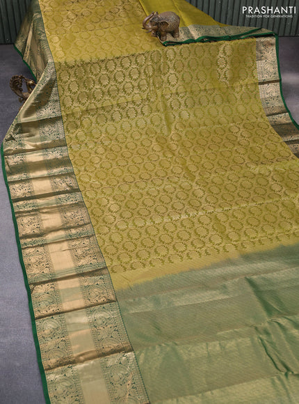 Kanchipuram silk saree mehendi green and green with allover zari woven brocade weaves and long annam zari woven border