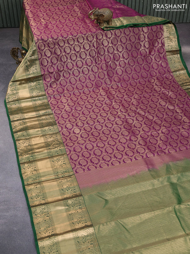 Kanchipuram silk saree purple and green with allover zari woven brocade weaves and long annam zari woven border