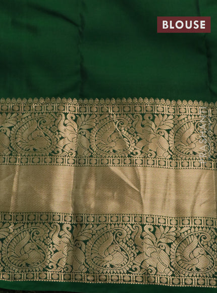 Kanchipuram silk saree purple and green with allover zari woven brocade weaves and long annam zari woven border