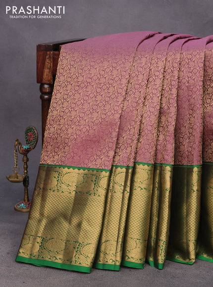 Kanchipuram silk saree purple shade and green with allover zari woven brocade weaves and long zari woven annam border