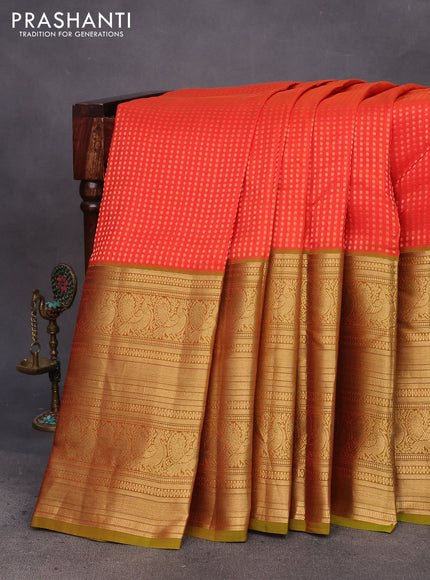 Kanchipuram silk saree orange and mehendi green with allover zari woven butta weaves and long annam zari woven border