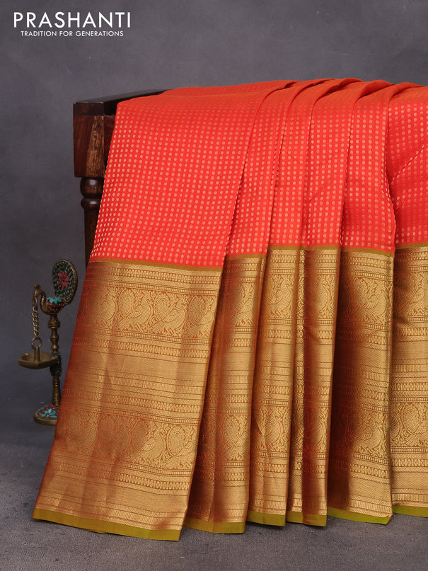 Kanchipuram silk saree orange and mehendi green with allover zari woven butta weaves and long annam zari woven border