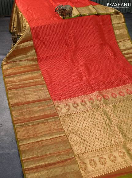 Kanchipuram silk saree orange and mehendi green with allover zari woven butta weaves and long annam zari woven border