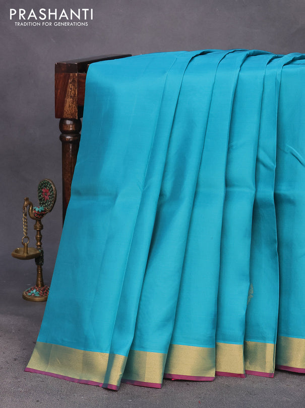 Kanchipuram silk saree teal blue shade and pink with zari woven buttas and zari woven border