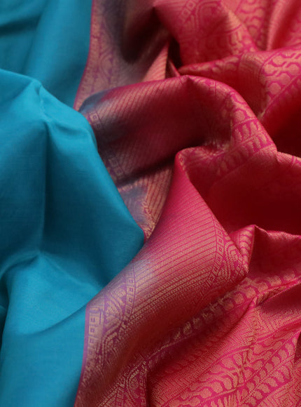 Kanchipuram silk saree teal blue shade and pink with zari woven buttas and zari woven border