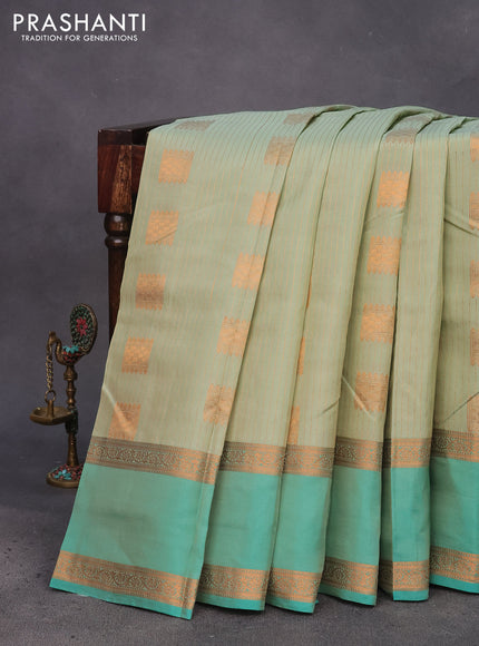 Kanchipuram silk saree pastel green and teal green with allover copper zari weaves & buttas and rettapet copper zari woven border