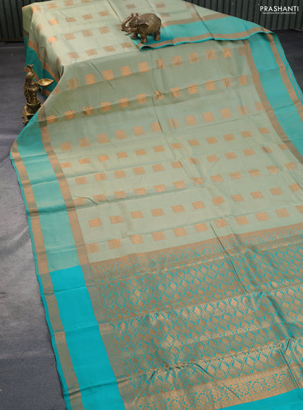 Kanchipuram silk saree pastel green and teal green with allover copper zari weaves & buttas and rettapet copper zari woven border