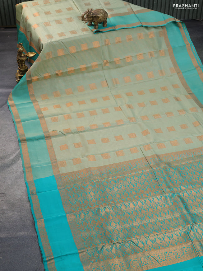 Kanchipuram silk saree pastel green and teal green with allover copper zari weaves & buttas and rettapet copper zari woven border