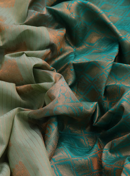 Kanchipuram silk saree pastel green and teal green with allover copper zari weaves & buttas and rettapet copper zari woven border