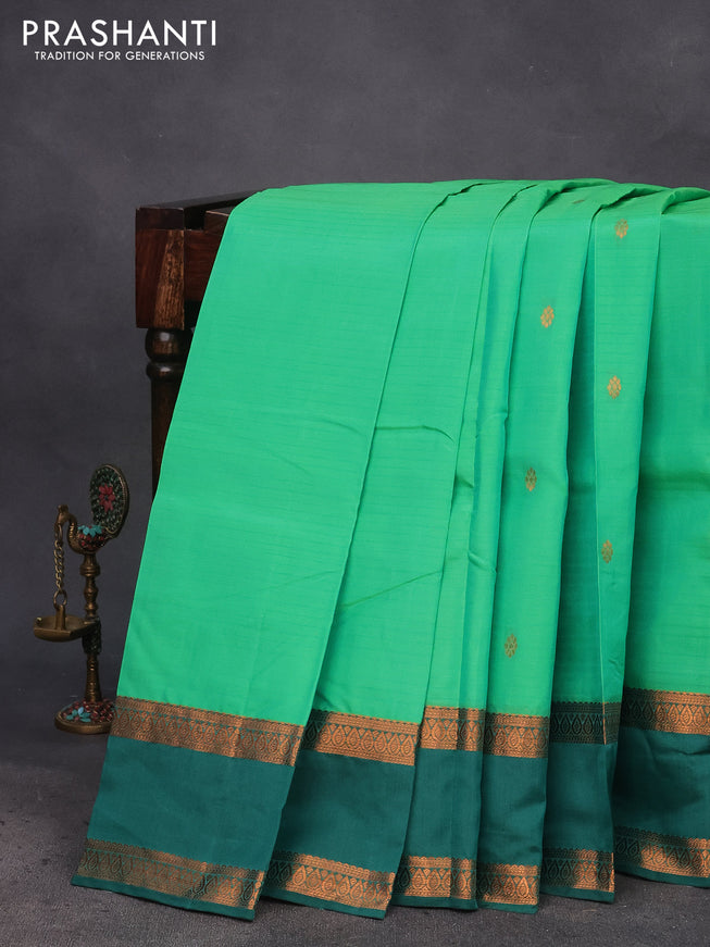 Kanchipuram silk saree green and bottle green with copper zari woven buttas and rettapet copper zari woven border