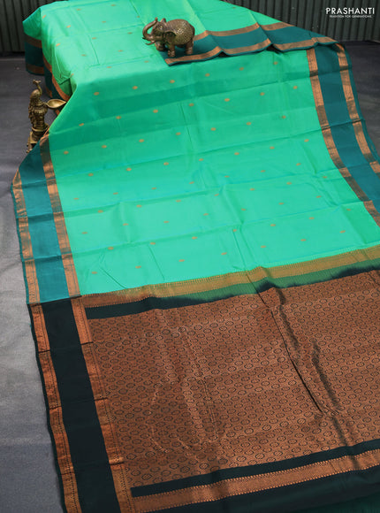 Kanchipuram silk saree green and bottle green with copper zari woven buttas and rettapet copper zari woven border