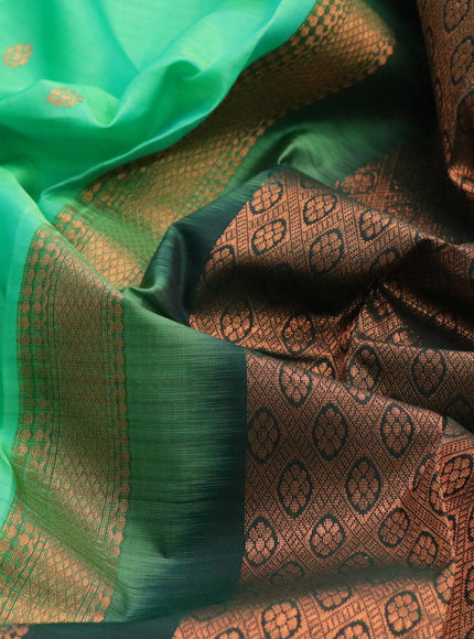 Kanchipuram silk saree green and bottle green with copper zari woven buttas and rettapet copper zari woven border