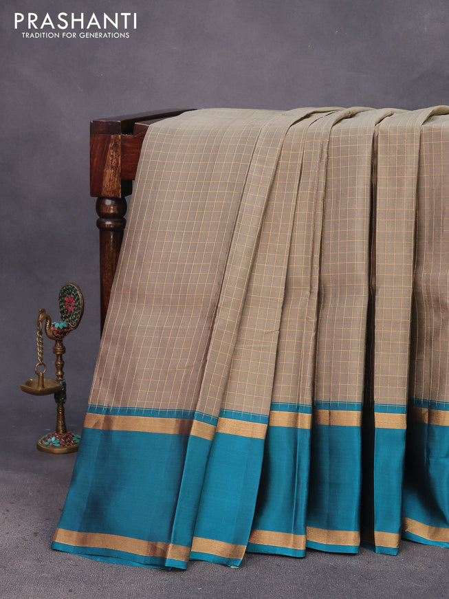 Kanchipuram silk saree chikku shade and teal blue shade with allover zari checked pattern and rettapet zari woven border