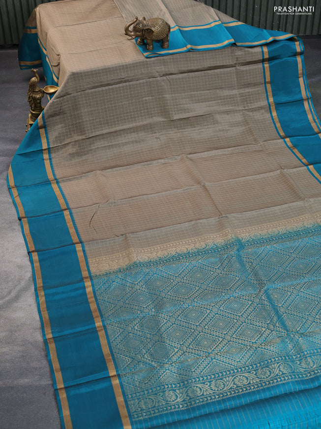 Kanchipuram silk saree chikku shade and teal blue shade with allover zari checked pattern and rettapet zari woven border