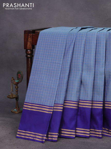 Kanchipuram silk saree blue shade and blue with allover zari checked pattern and rettapet zari woven border