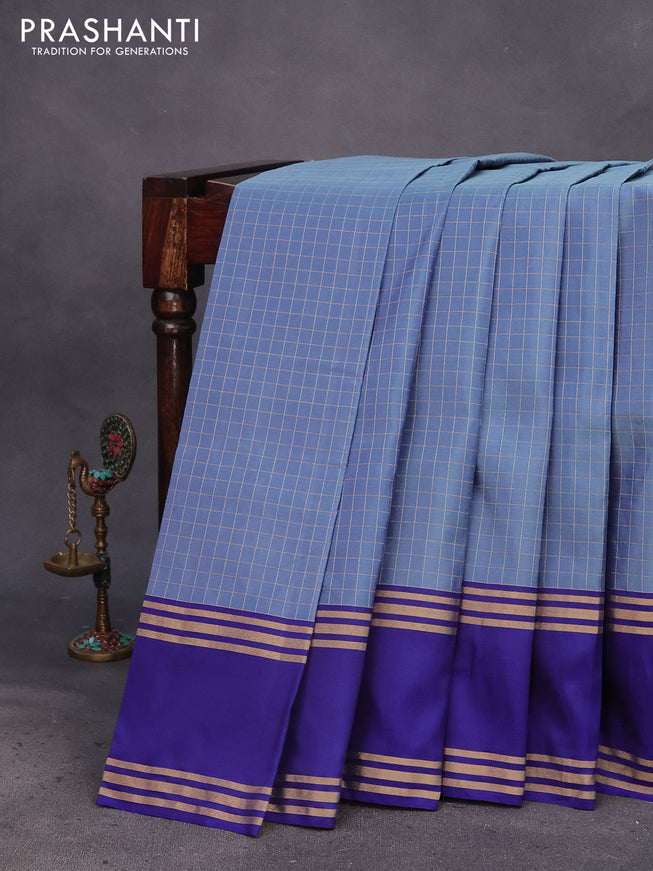 Kanchipuram silk saree blue shade and blue with allover zari checked pattern and rettapet zari woven border