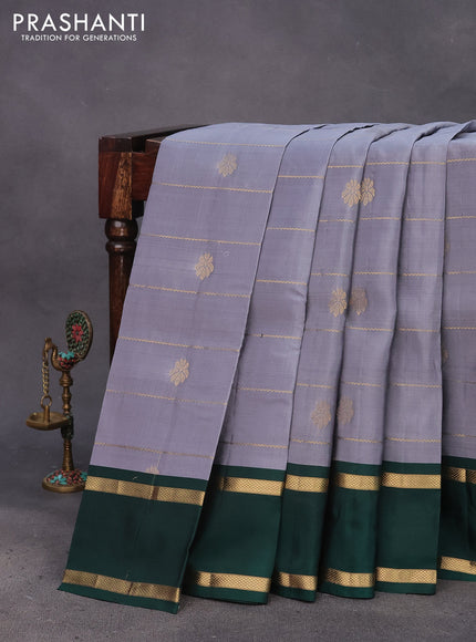 Kanchipuram silk saree grey and bottle green with allover zari weaves & buttas and rettapet zari woven border