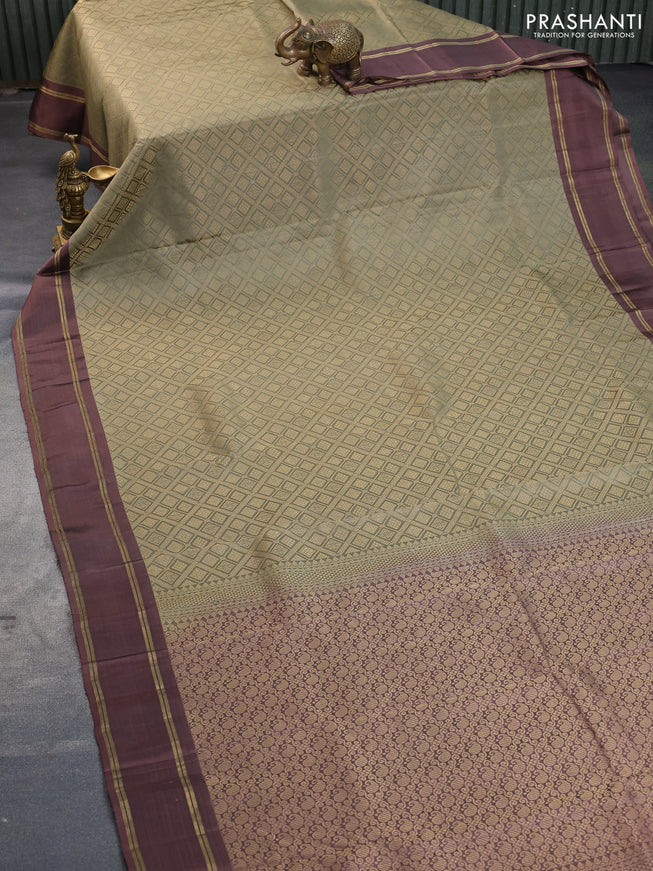 Kanchipuram silk saree elaichi green shade and rosy brown with allover zari woven brocade weaves and rettapet zari woven border