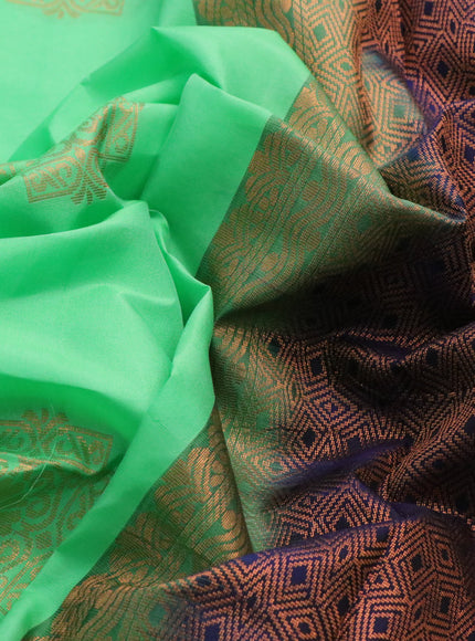 Kanchipuram silk saree green and navy blue with copper zari woven buttas in borderless style