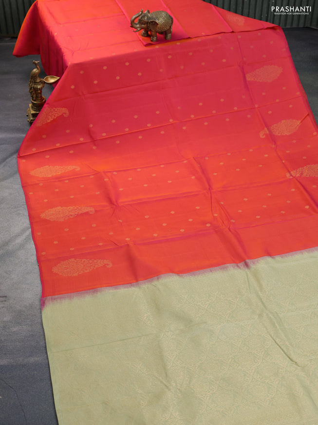 Kanchipuram silk saree dual shade of pinkish orange and elaichi green with zari woven buttas in borderless style