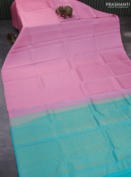 Kanchipuram silk saree light pink and teal blue with allover zari weaves in borderless style