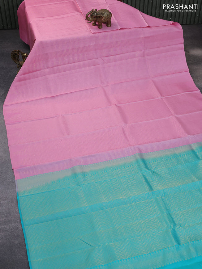 Kanchipuram silk saree light pink and teal blue with allover zari weaves in borderless style