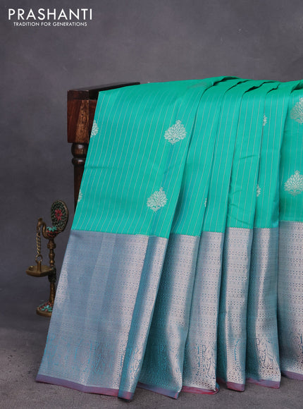 Kanchipuram silk saree teal green shade and maroon with allover silver zari strip weaves & buttas and long silver zari woven border