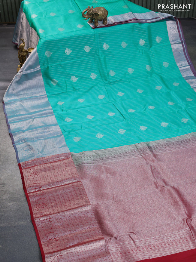 Kanchipuram silk saree teal green shade and maroon with allover silver zari strip weaves & buttas and long silver zari woven border