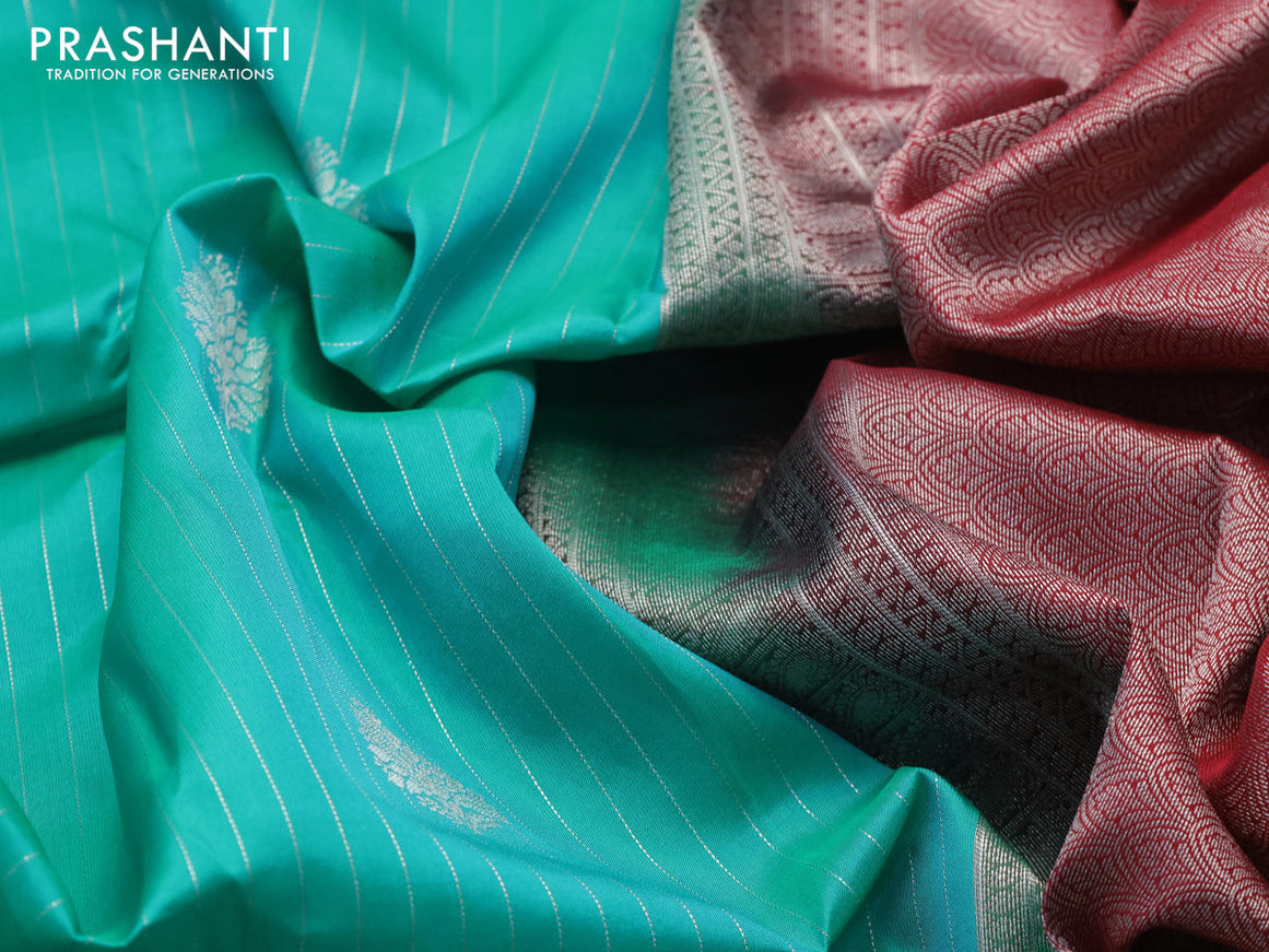 Kanchipuram silk saree teal green shade and maroon with allover silver zari strip weaves & buttas and long silver zari woven border