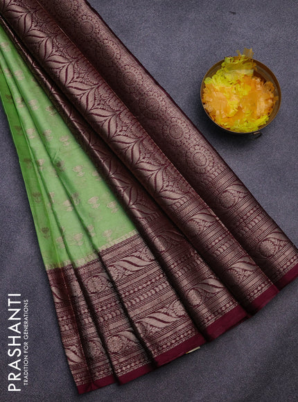 Banarasi semi silk saree pista green and wine shade with allover floral zari woven buttas and long woven border