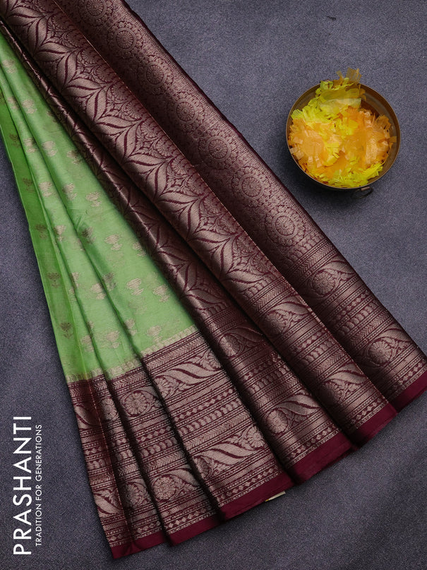 Banarasi semi silk saree pista green and wine shade with allover floral zari woven buttas and long woven border