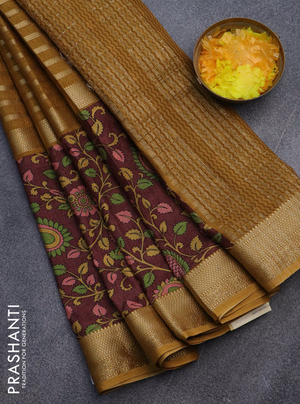 Semi crepe saree dark mustard and brown with zari weaves and long kalamkari printed zari border