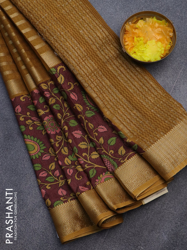 Semi crepe saree dark mustard and brown with zari weaves and long kalamkari printed zari border