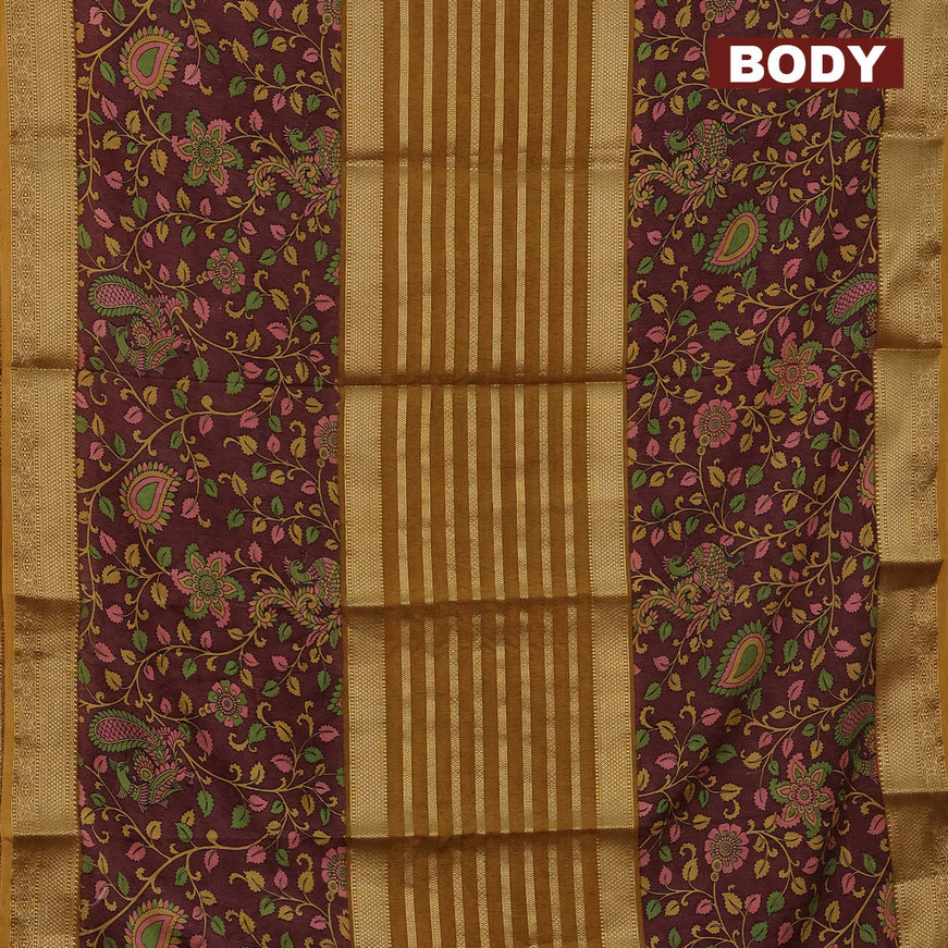 Semi crepe saree dark mustard and brown with zari weaves and long kalamkari printed zari border