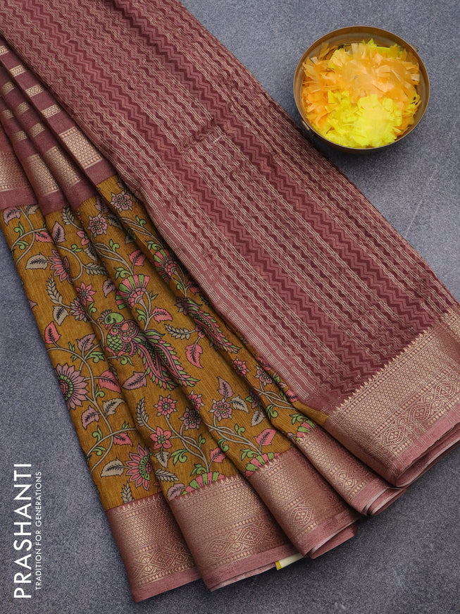 Semi crepe saree pastel brown and dark mustard with zari weaves and long kalamkari printed zari border