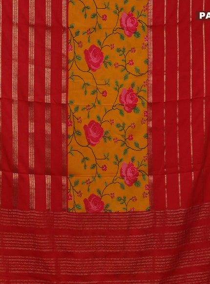 Semi crepe saree mustard yellow and red with floral prints and long zari woven simple border