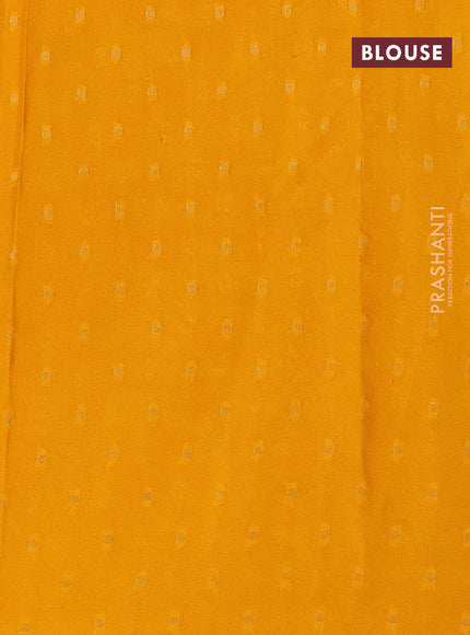 Semi crepe saree mustard yellow and red with floral prints and long zari woven simple border