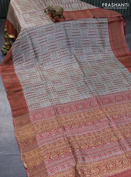 Pure tussar silk saree beige and rust shade with allover prints and zari woven border