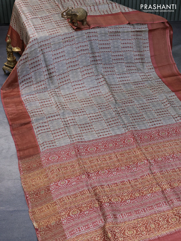 Pure tussar silk saree beige and rust shade with allover prints and zari woven border