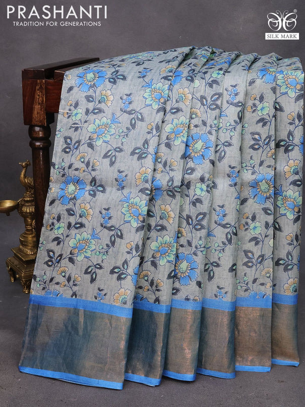 Pure tussar silk saree grey and cs blue with allover floral prints and zari woven border